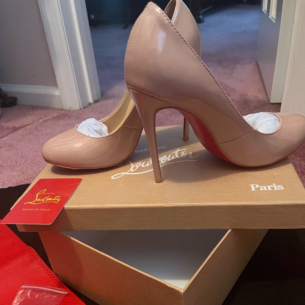 Christian Louboutin nude pumps. Purchased them but are too high for me.